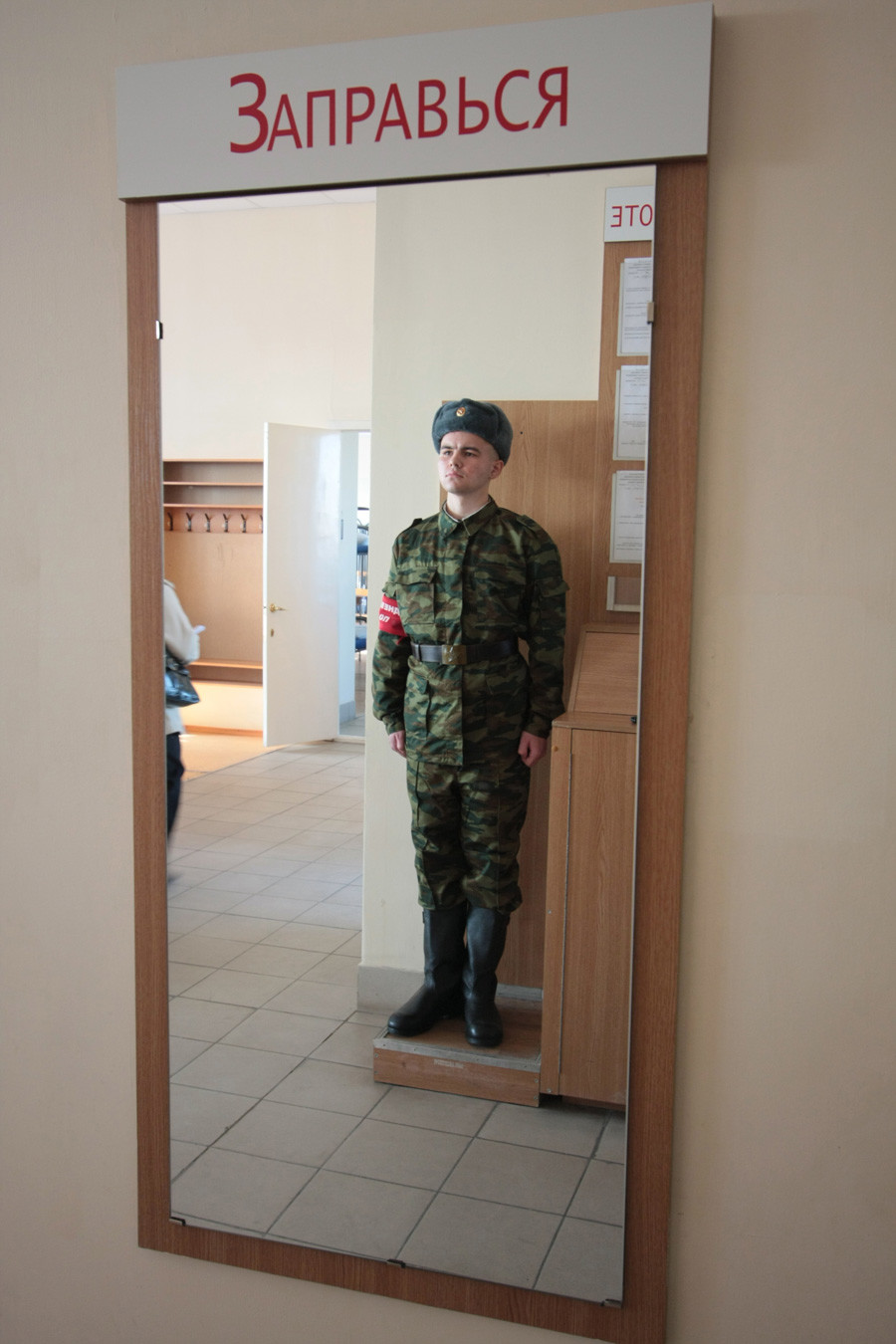 Barracks soldier is on duty at Patriot enlistment office in Kazan.