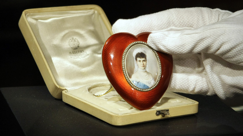 A Faberge silver-gilt, pearl and enamel heart-shaped photograph frame enclosing a miniature of Empress Maria Fedorovna 