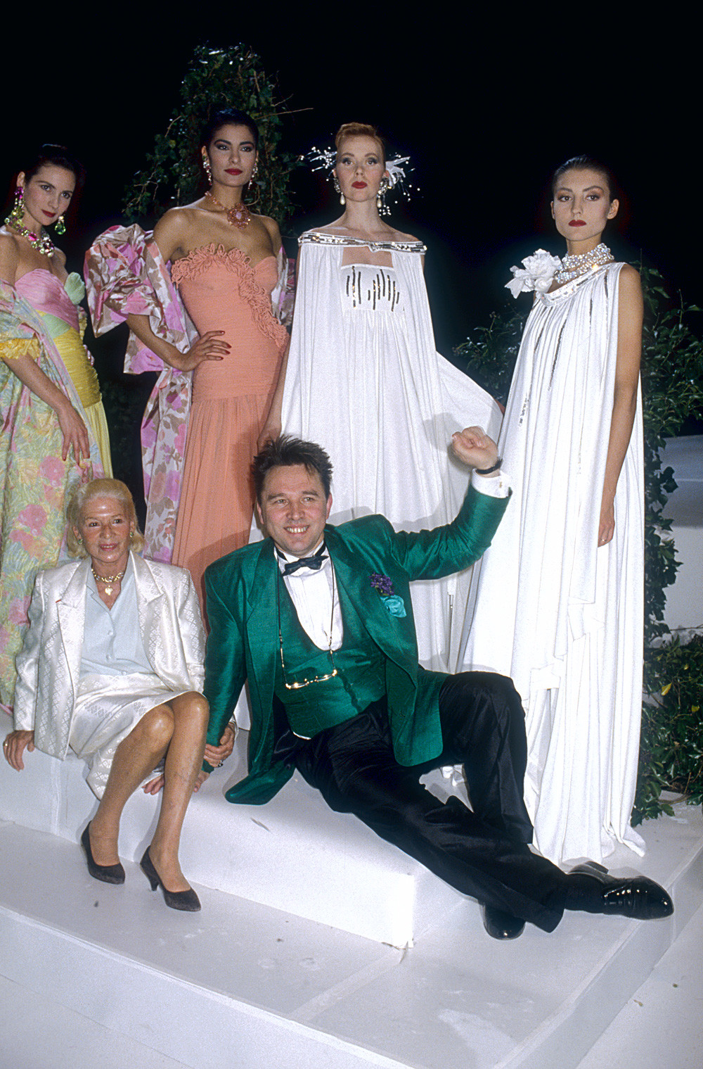 Slava Zaitsev with French fashion designer Madame Carven and models wearing his haute couture evening gowns (Spring-Summer 1988 fashion show in Paris)