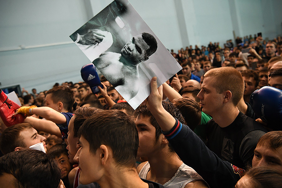 Fans ask for autographs during a master class by Mike Tyson in the city of Yekaterinburg