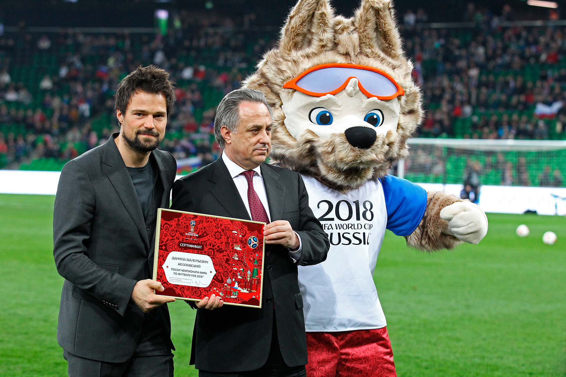 Danila Kozlovsky, President of the Russian Football Union Deputy Prime Minister V. Mutko and the 2018 FIFA World Cup official mascot Zabivaka during the ceremony of certifying Danila Kozlovsky as a 2018 FIFA World Cup Ambassador prior to the football friendly match between Russia and Côte d’Ivoire.