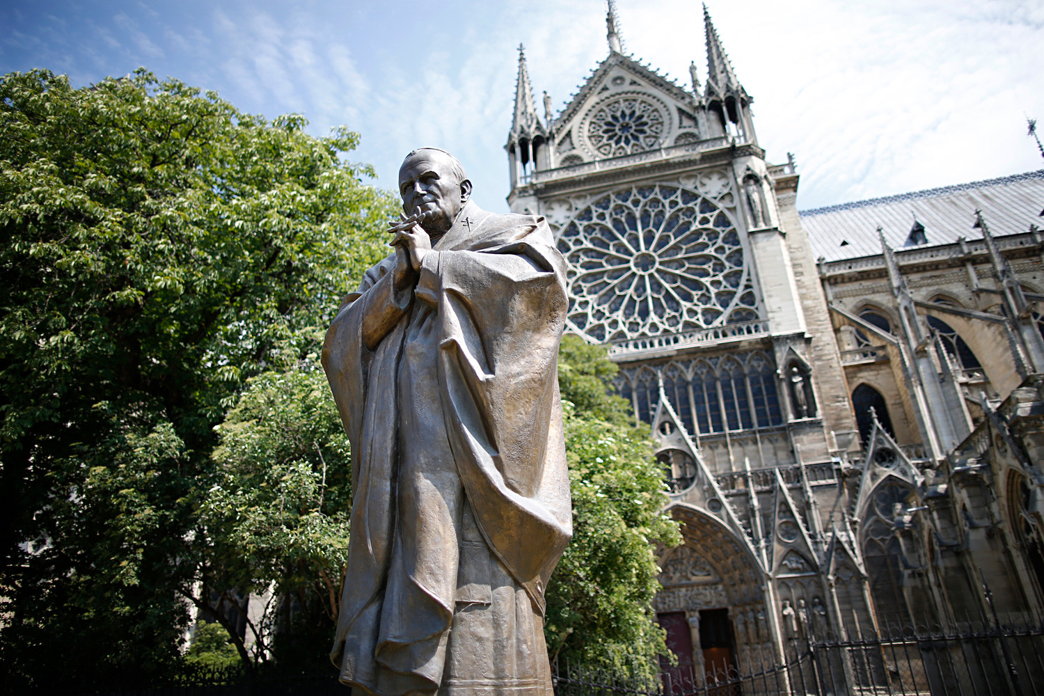 The sculpture of Pope John Paul II near the Notre-Dame Cathedral in Paris