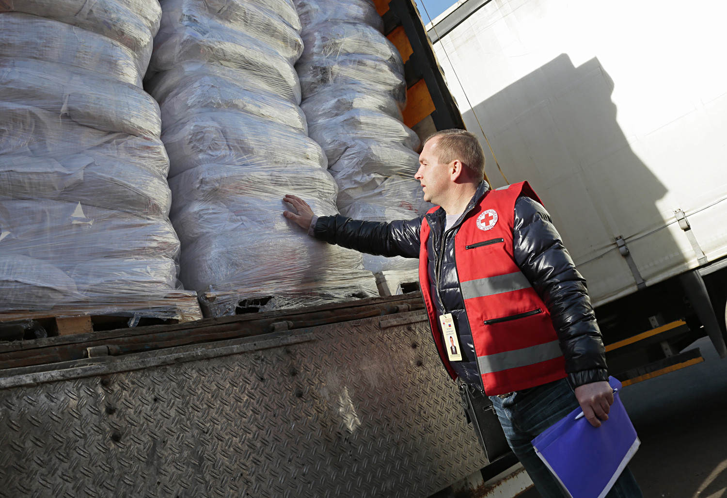 An employee of the Moscow city branch of the Russian Red Cross seen ahead of sending the 2nd humanitarian aid convoy to Donetsk.