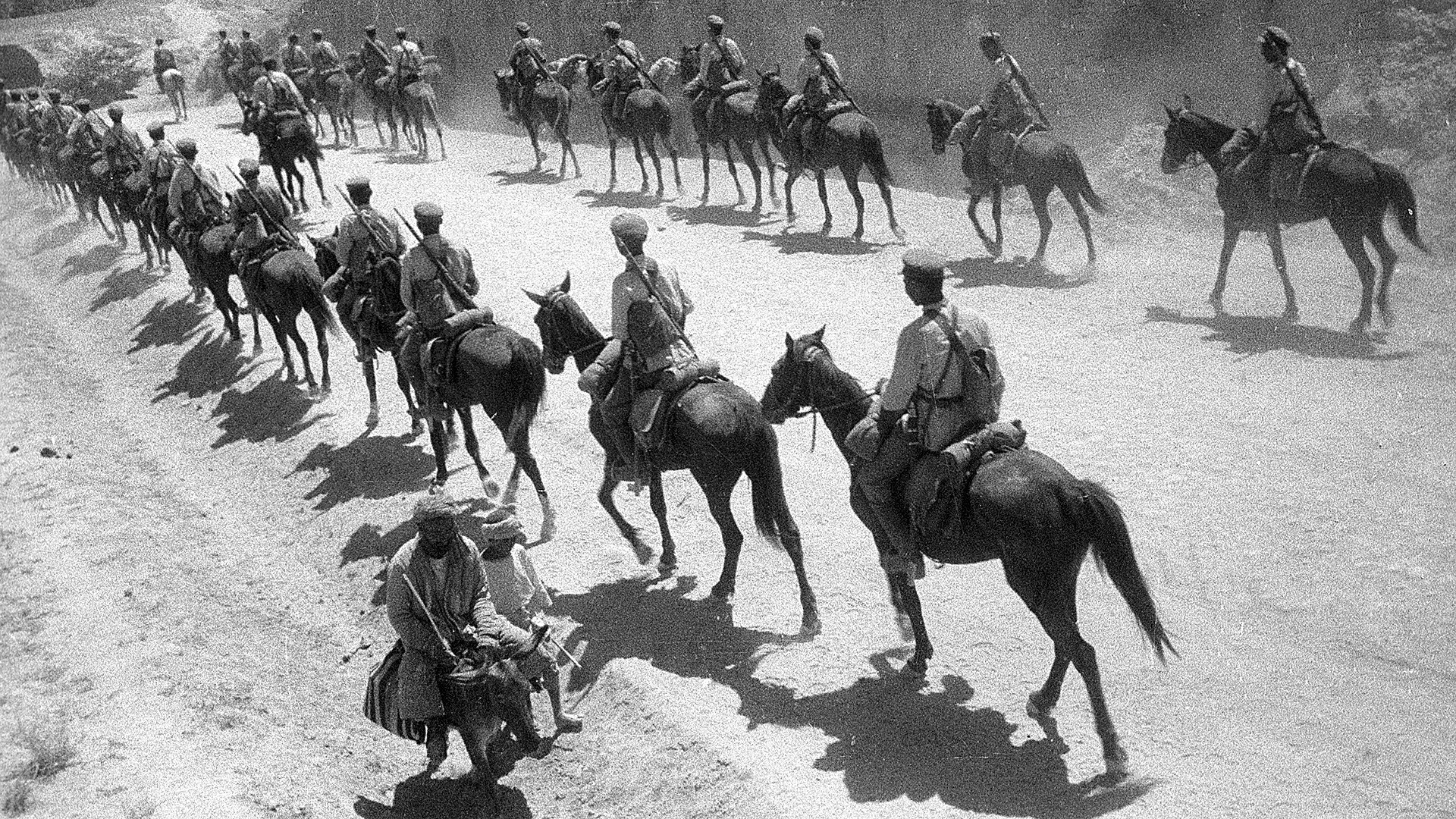 Red cavalrymen on the march.