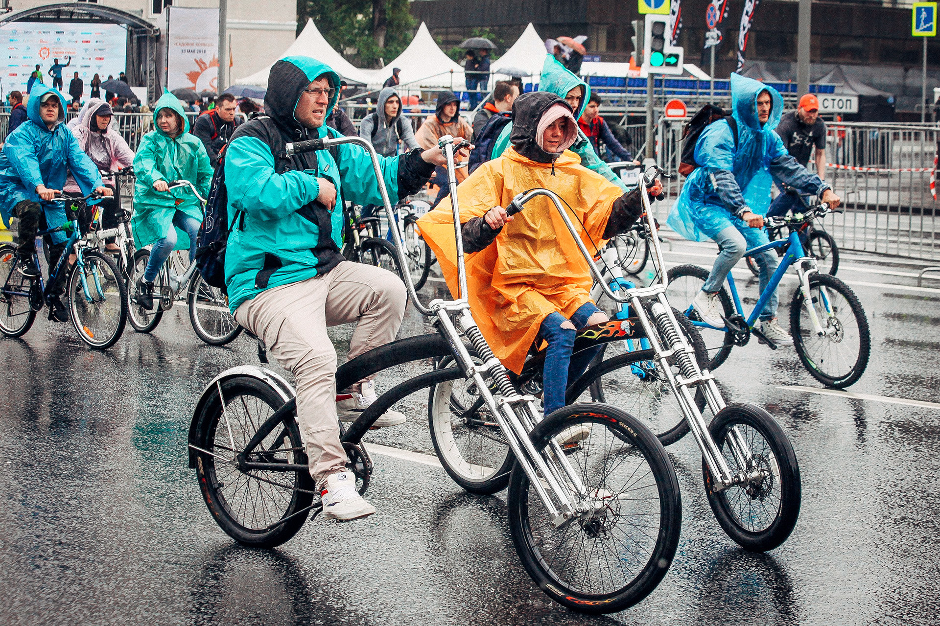 Heavy rain in Moscow fails to dampen cyclists' spirits (Photos