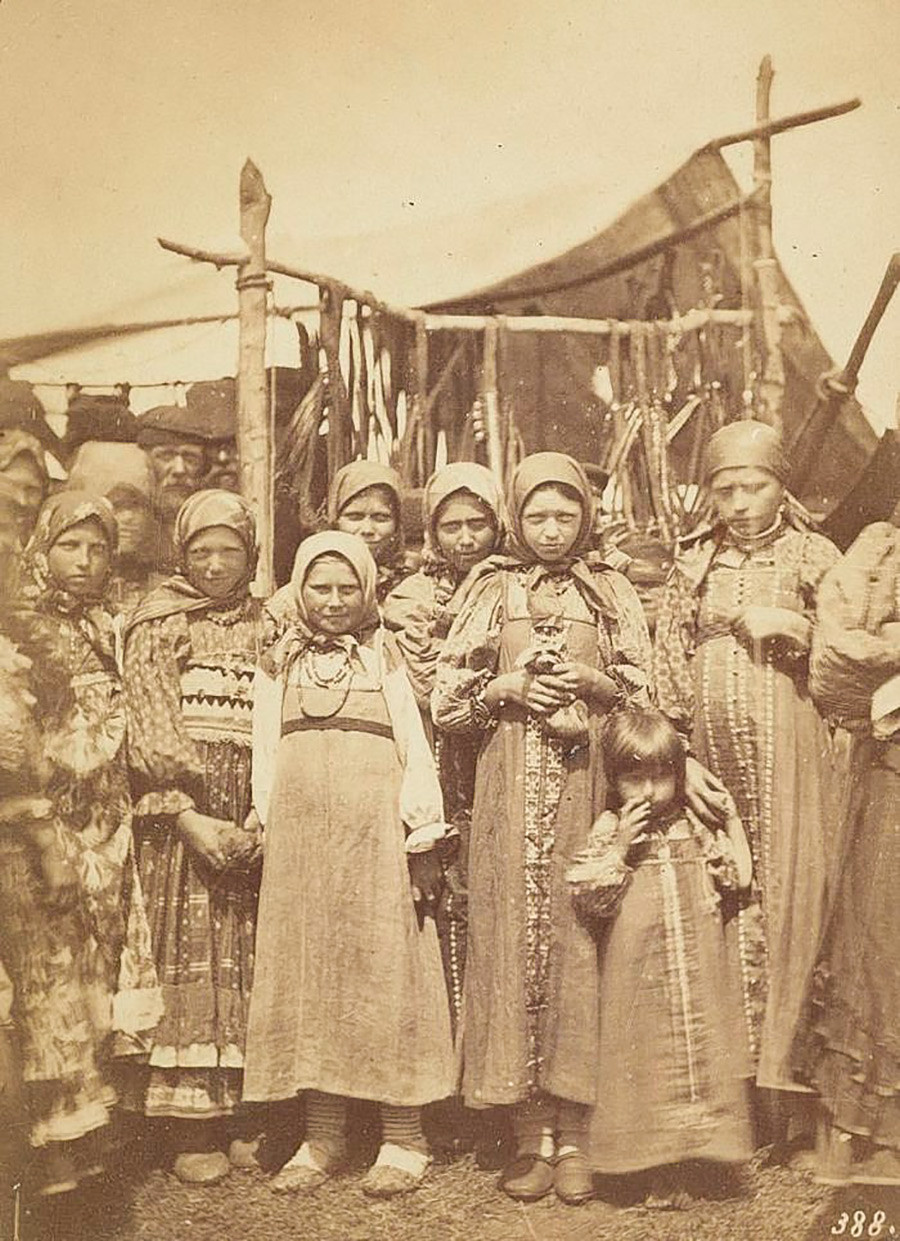 Group of girls wearing traditional peasant costumes. 