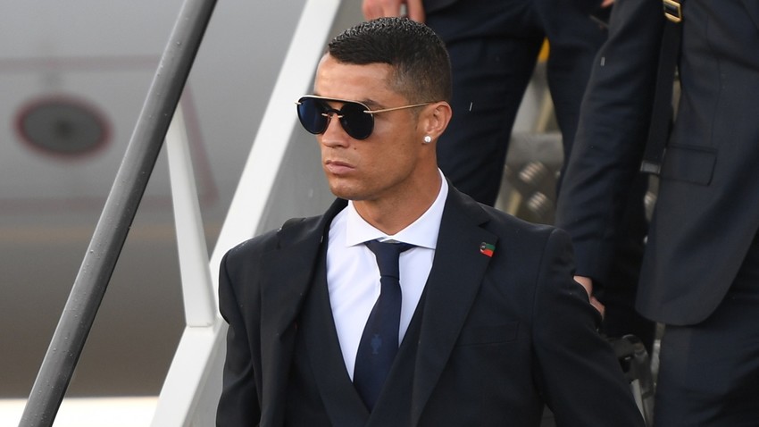 Portugal's Cristiano Ronaldo walks down the runway upon Portugal's national soccer team's arrival at the airport ahead of the World Cup in Moscow, Russia, June 09, 2018.