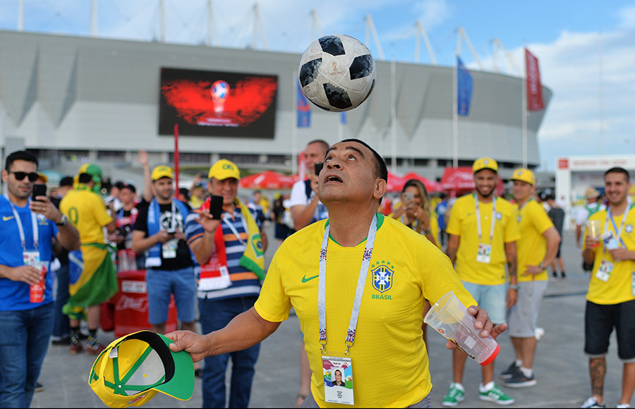 Brazil's fan plays with a ball ahead of the World Cup Group E soccer match between Brazil and Switzerland in Rostov-on-Don, Russia, June 17, 2018.