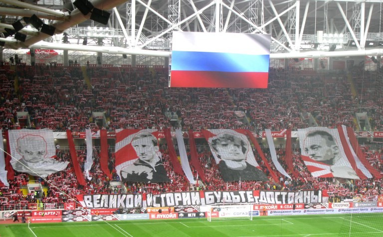Spartak fans urge their current team to live up to the club’s lustrous history prior to the opening league game at the Otkrytiye Arena.