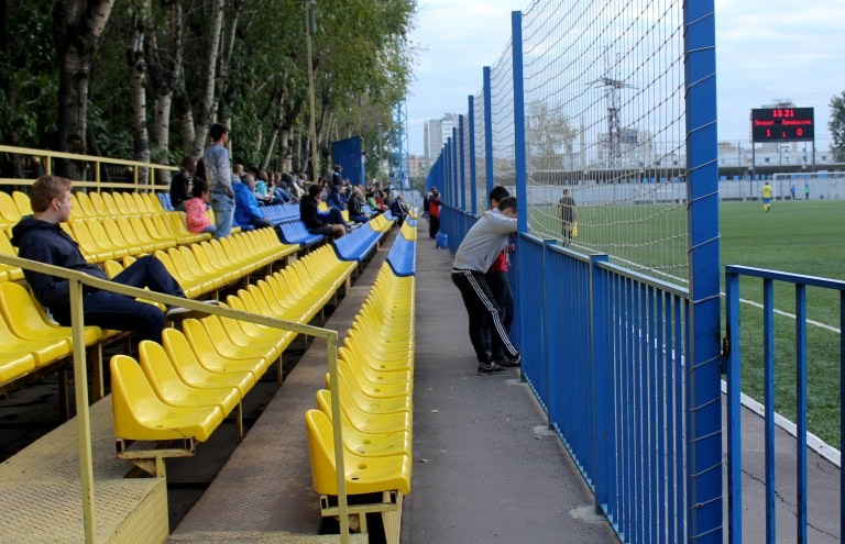A small crowd gathers at the new seating area at Reutov’s Start Stadium.