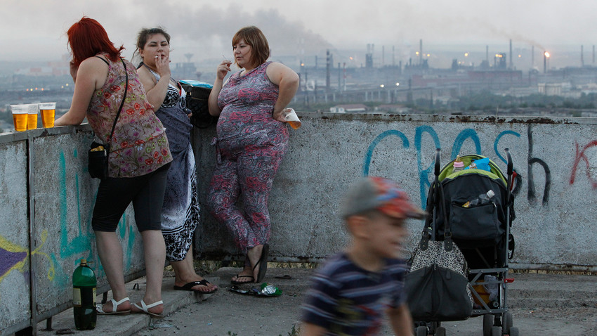 Women relaxing at an observatin point in the industrial city of Magnitogorsk, Russia