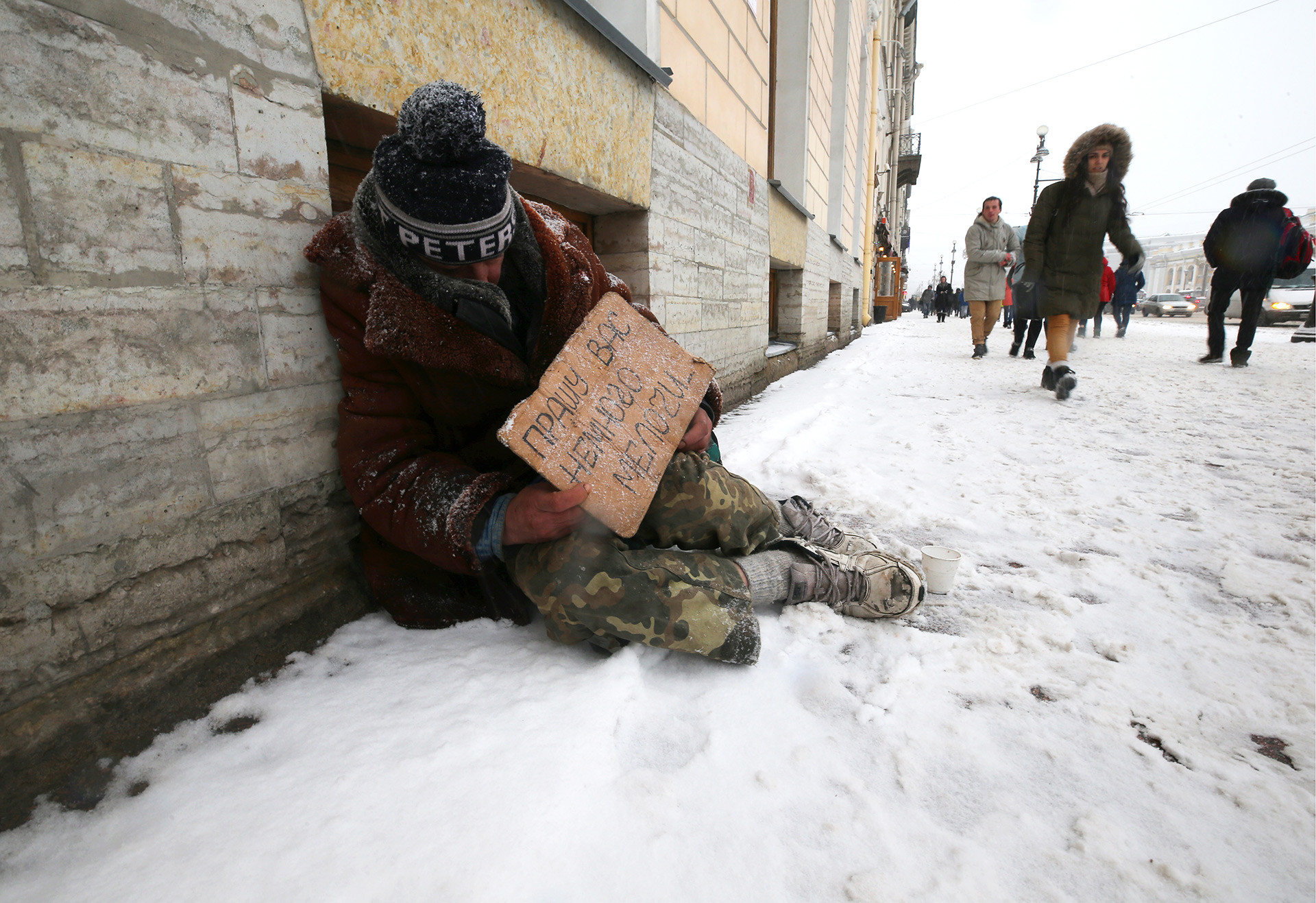 Homeless man sleeping rough, Russia