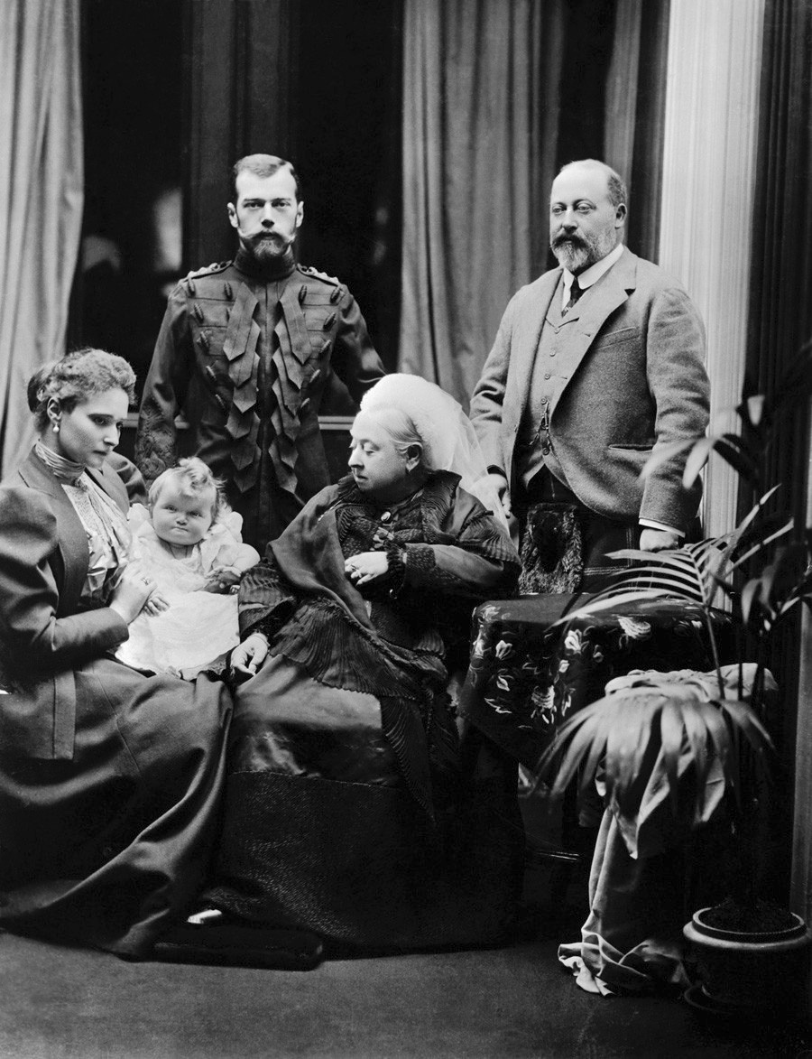 Victoria, Queen of Great Britain, at Balmoral Castle in Scotland, with her son Edward, Prince of Wales (right), and Tsar Nicholas II of Russia (left). Seated on the left is Alexandra, Tsarina of Russia, holding her baby daughter Grand Duchess Tatiana.