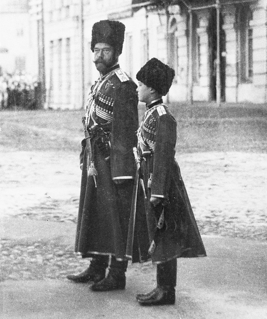 Nicholas II and Alexei in the Cossack uniforms at the military parade, 1916.