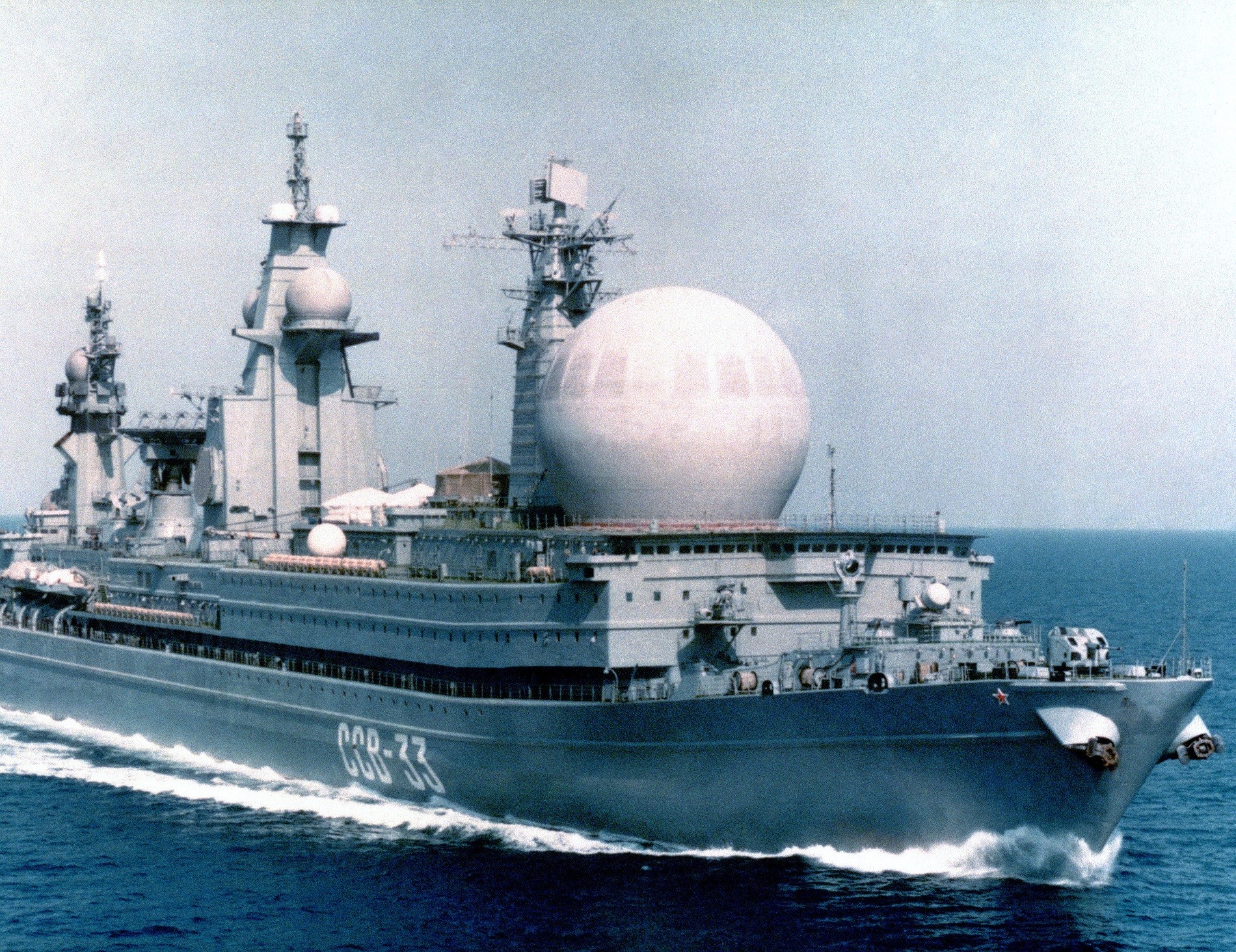 A starboard bow view of the Soviet naval auxiliary Kapusta Class Nuclear Powered Missile Range Ship SSV 33 underway.