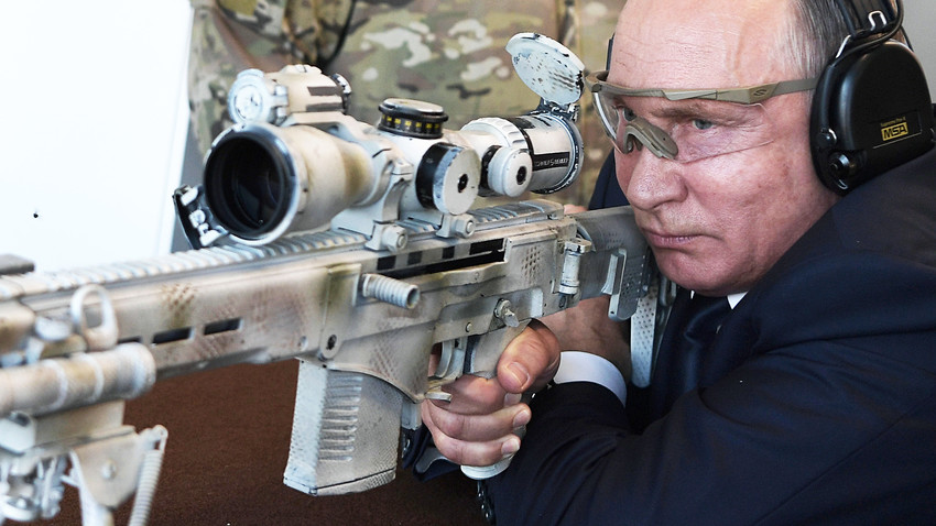  Sept. 19, 2018. Russian President Vladimir Putin prepares to shoot from a Chukavin sniper rifle (SVCh-308) at Kalashnikov Concern Shooting Club at Patriot Park.