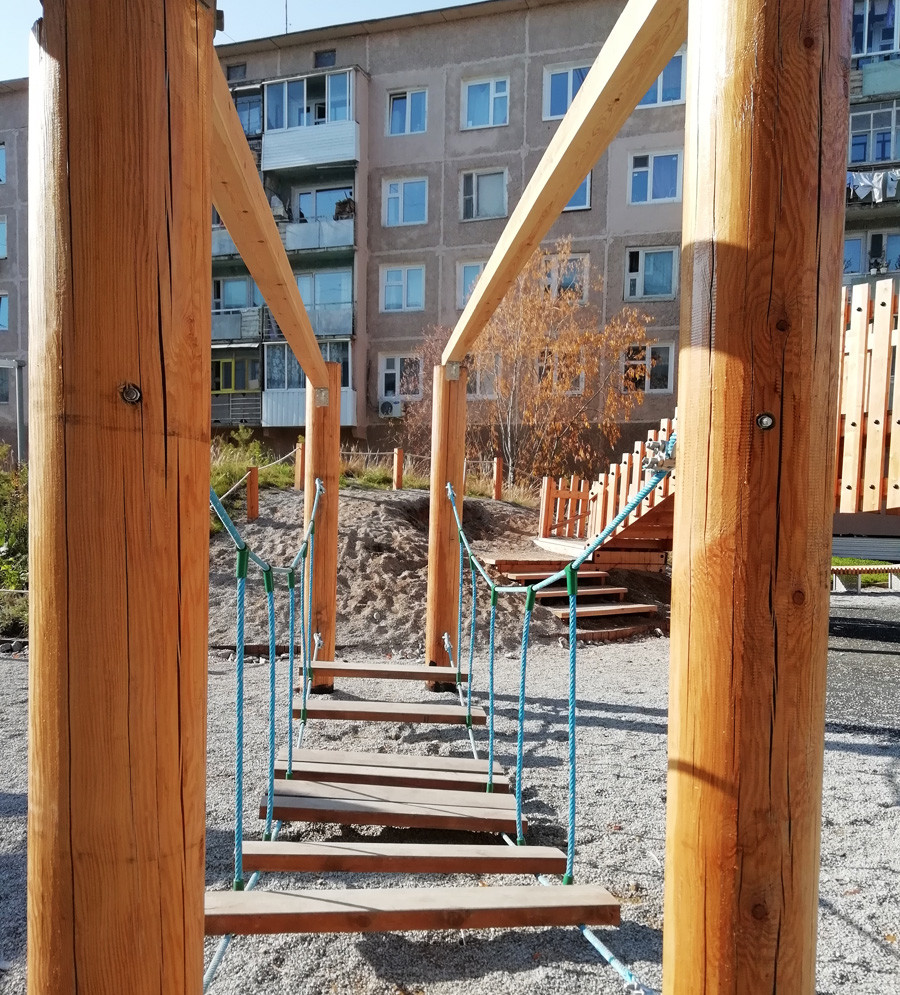 Wooden playground in the yard.