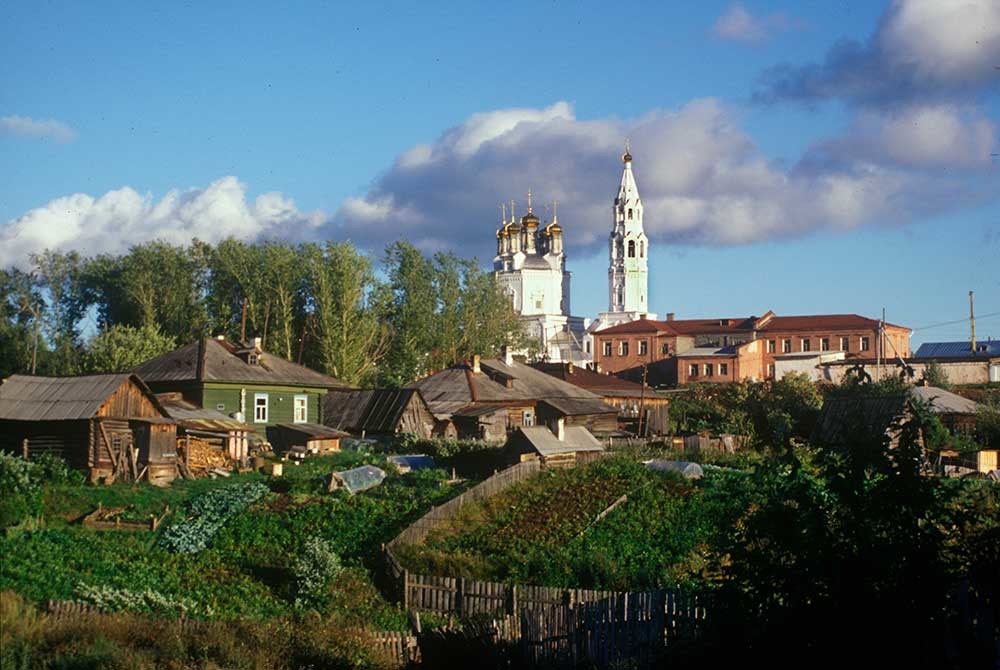 Trinity Cathedral & bell tower. Northwest view with wooden houses. August 26, 1999