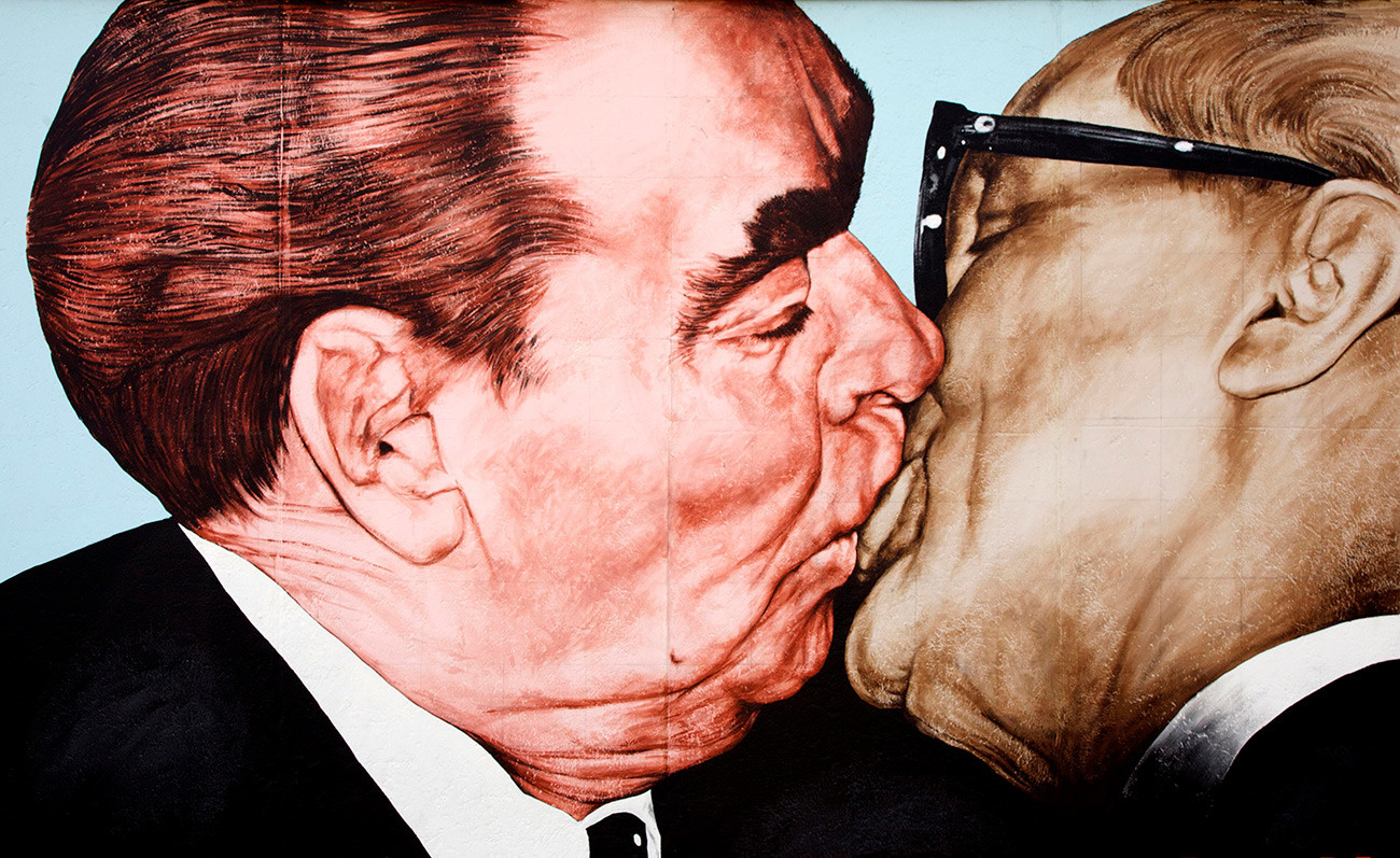 Leonid Brezhnev loved to kiss men (not sexually) but not everyone was allowed to do so. Painting by Russian artist Dimitry Vrubel of Brezhnev kissing Honecker on the Berlin Wall, East Side Gallery.