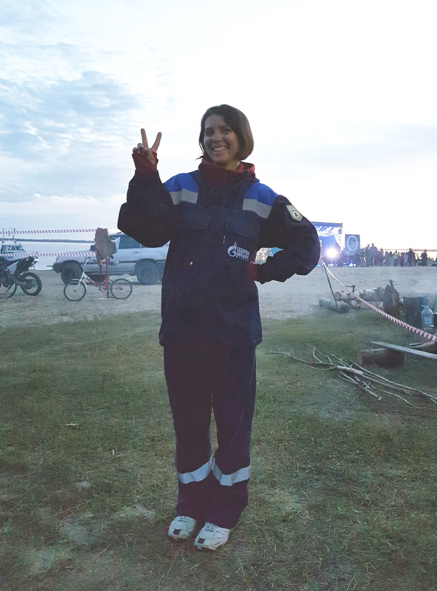 Dasha is at a festival organised by Gazprom for its workers on the Ob river near the village of Peregrebnoe. As it got a bit colder, Dasha put on her work clothes, which she usually wears in the gas field near her home some 300km further north. The photo was actually taken at midnight!