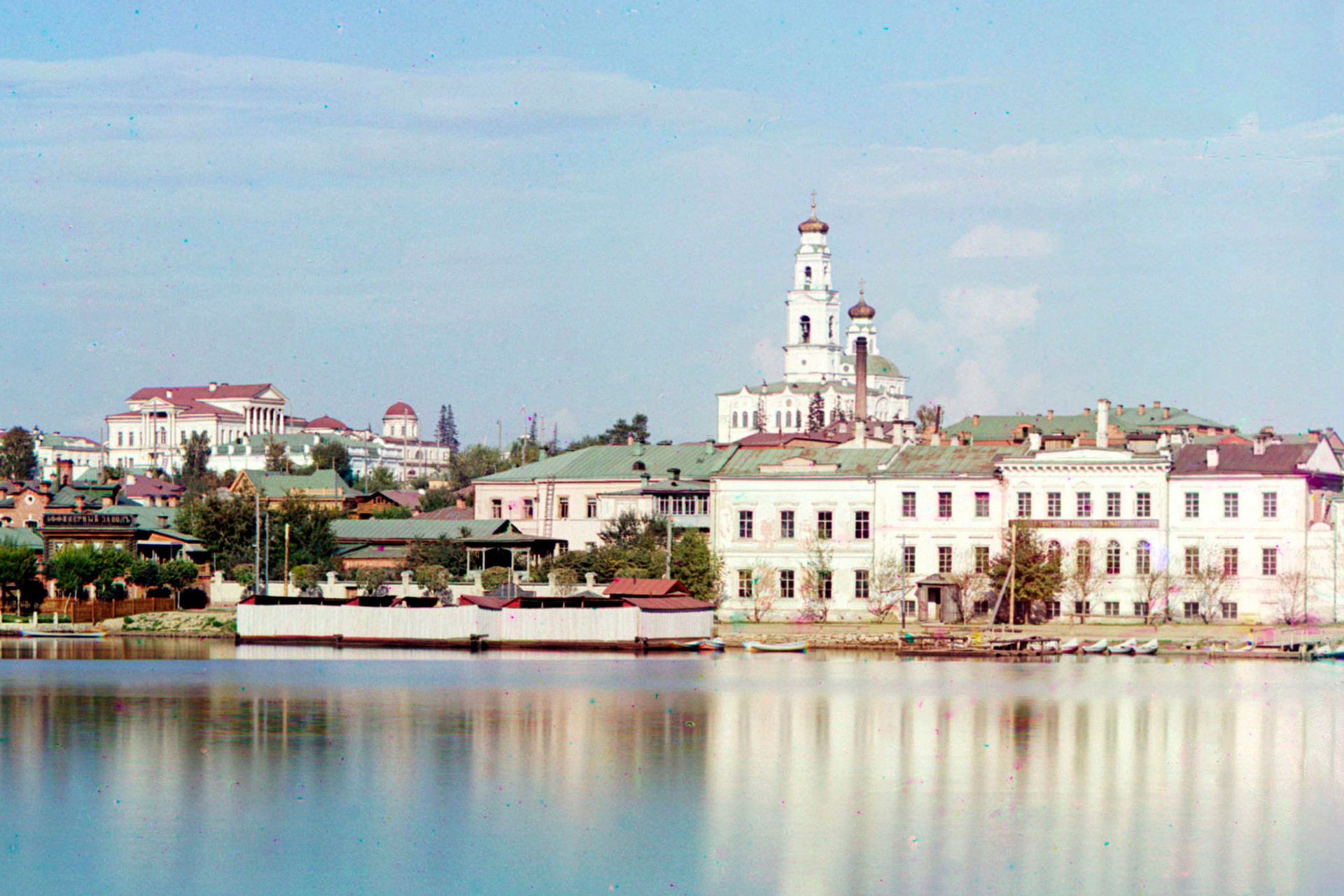 Yekaterinburg. View across City Pond toward Ascension Hill. From left:  Rastorguev-Kharitonov Mansion, Ipatyev house (partially visible beneath main portico of Kharitonov Mansion), bell tower & Church of Ascension. Summer 1909.