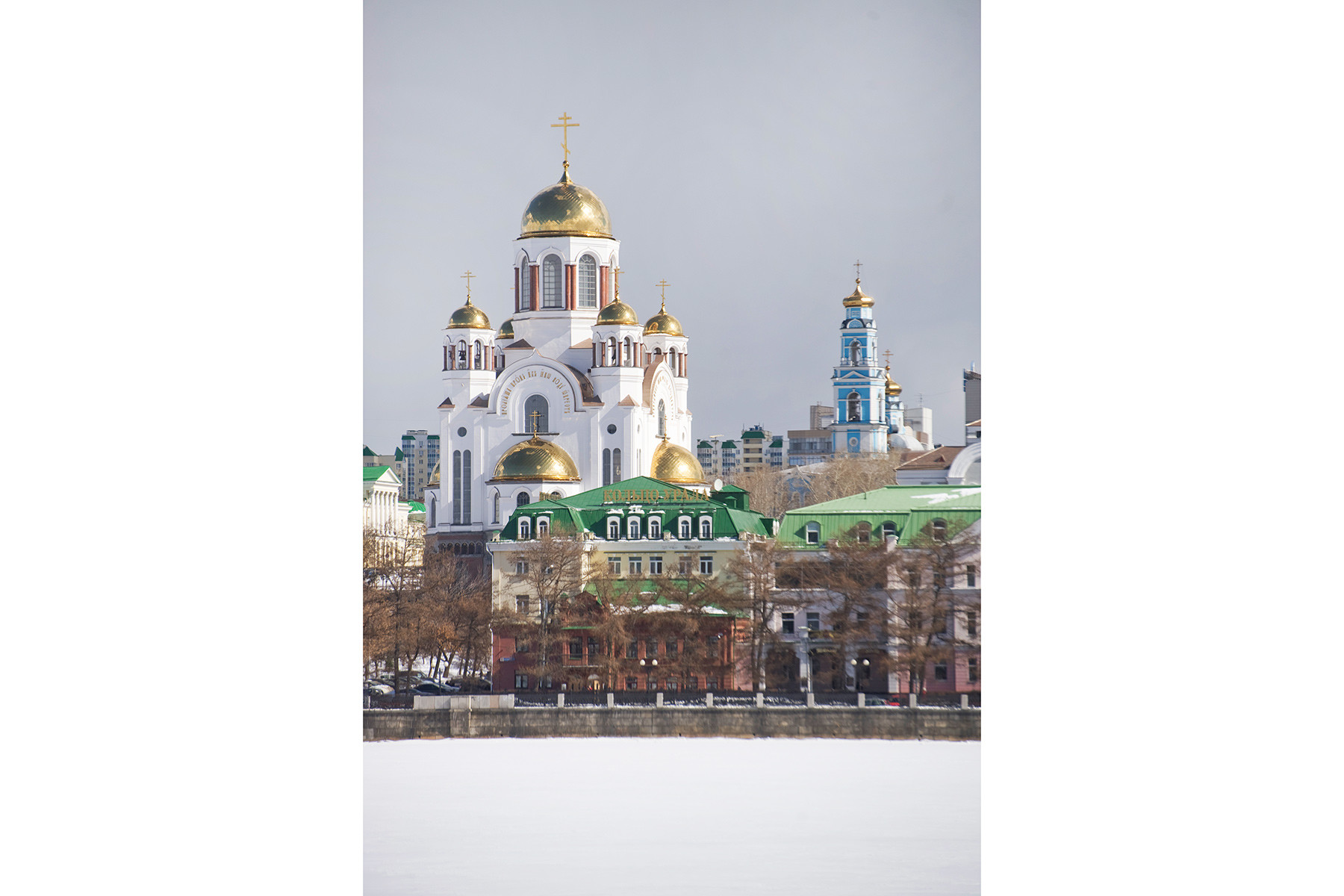 Church of All Saints Resplendent in the Russian Land, southwest view across City Pond. Background: Bell tower of Ascension Church. April 4, 2017.