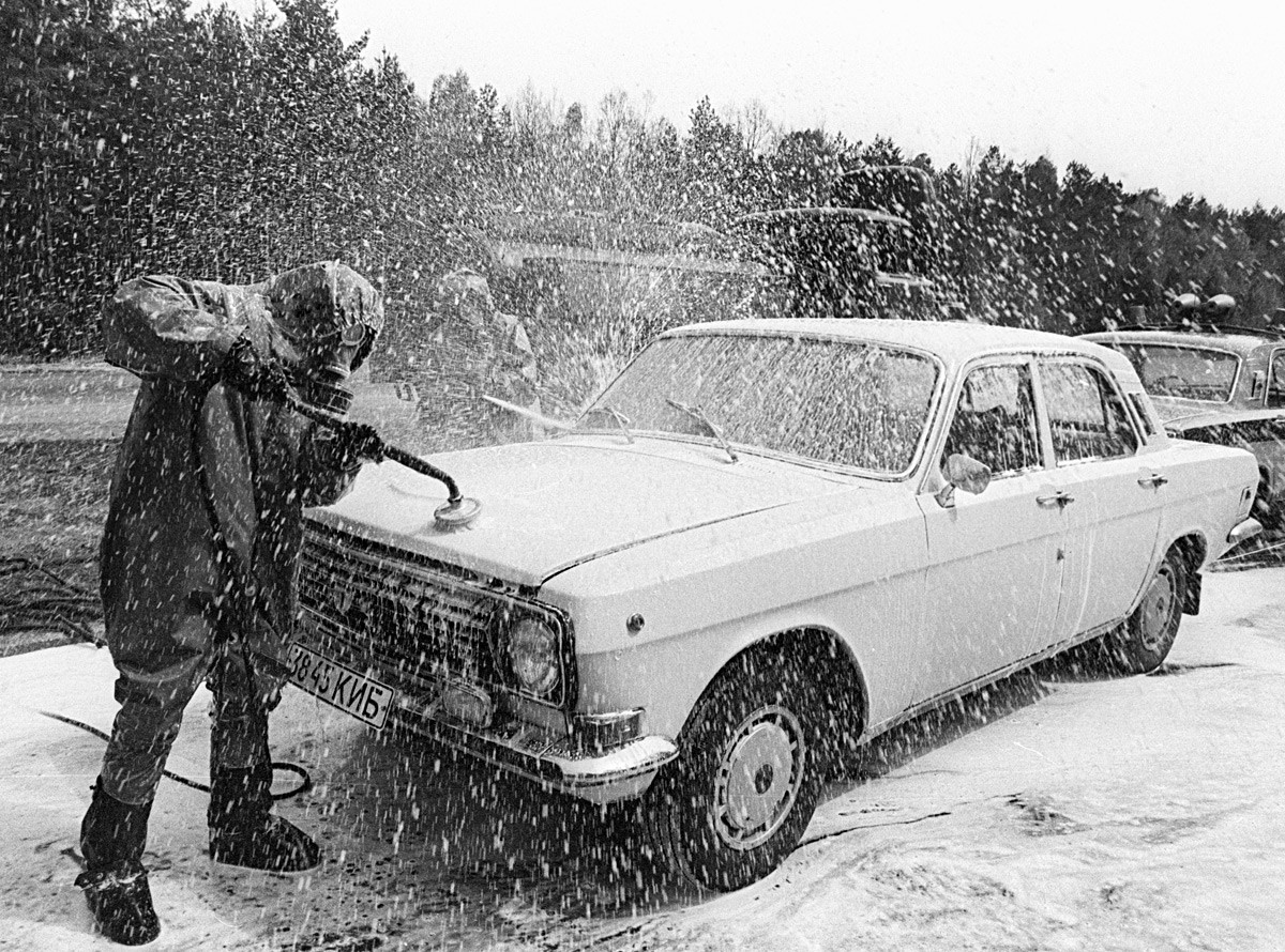 Decontamination of a car exiting the region of the disaster