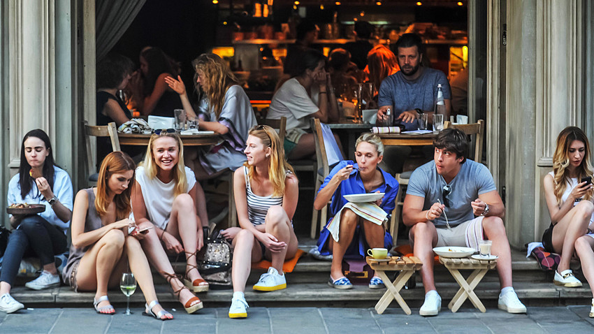 People in a sidewalk cafe in central Moscow. 