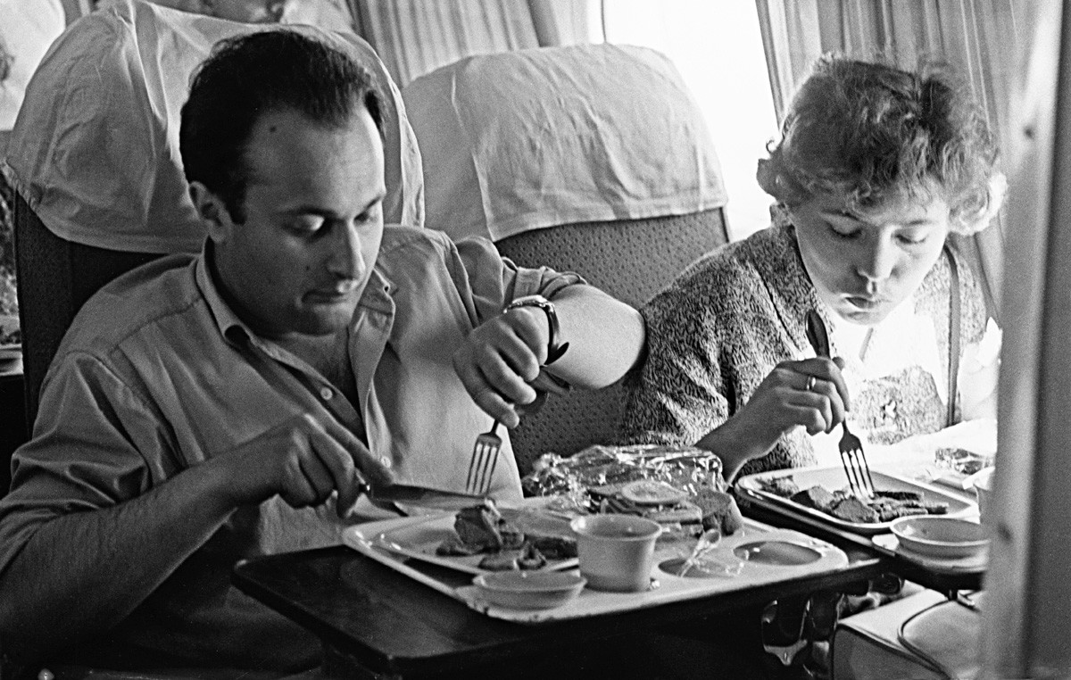 Passengers dine on board Tu-104, the first Soviet passenger jet. 