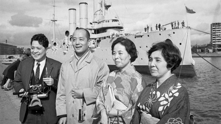 Japanese tourists with the Avrora cruiser in the background. Leningrad, 1968 