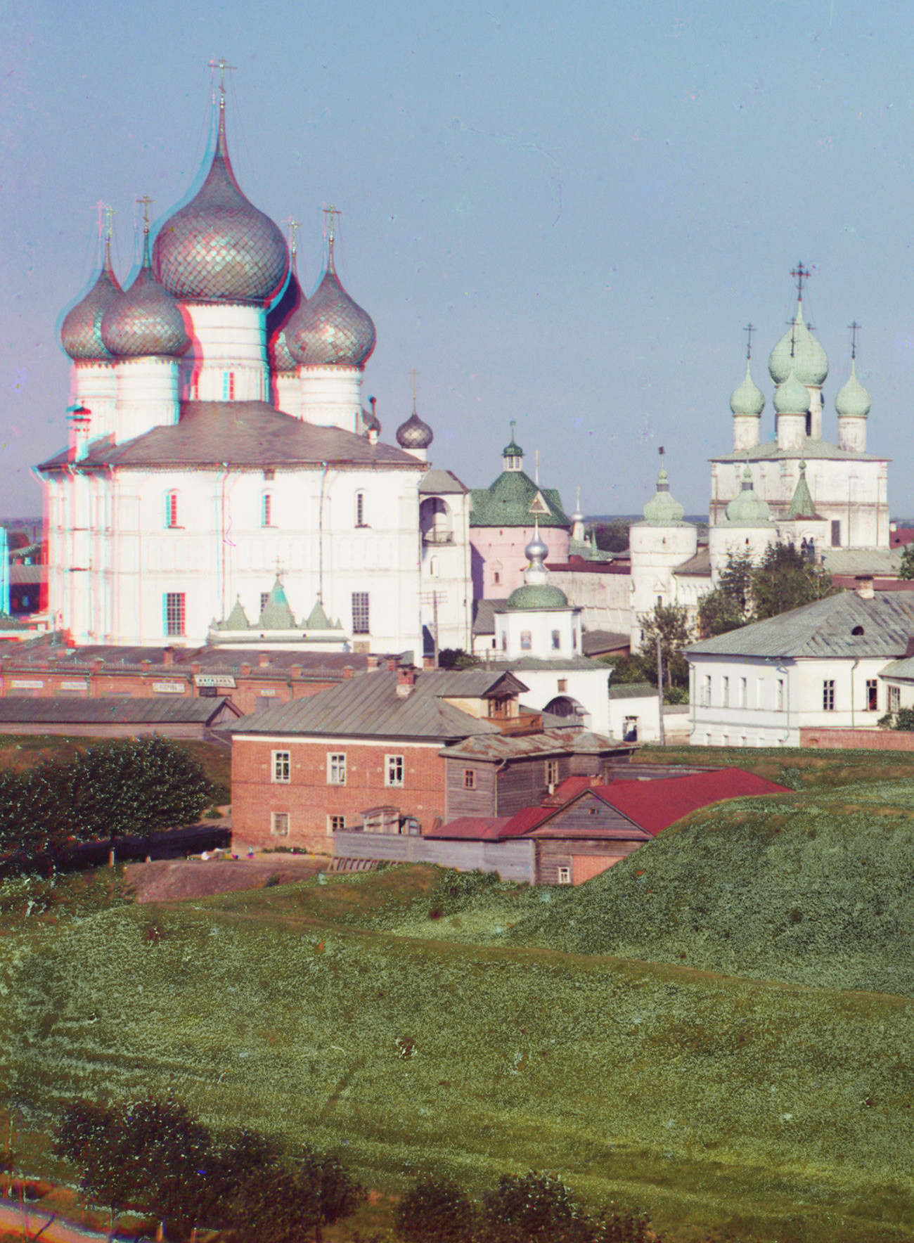 Cathedral compound, northwest view. From left: Dormition Cathedral, belfry, Holy Gate, north Kremlin wall with Church of Resurrection over North Gate. Summer 1911
