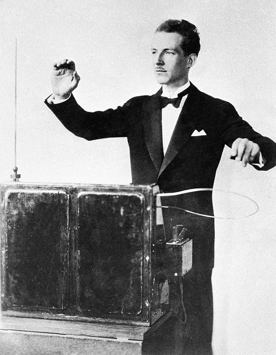 Theremin playing an electric musical instrument invented by him