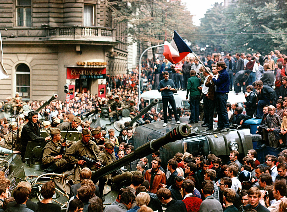 Soviet soldiers try to get to Prague headquarters of Czechoslovak Radio through streets packed by protesting people in August 1968.
