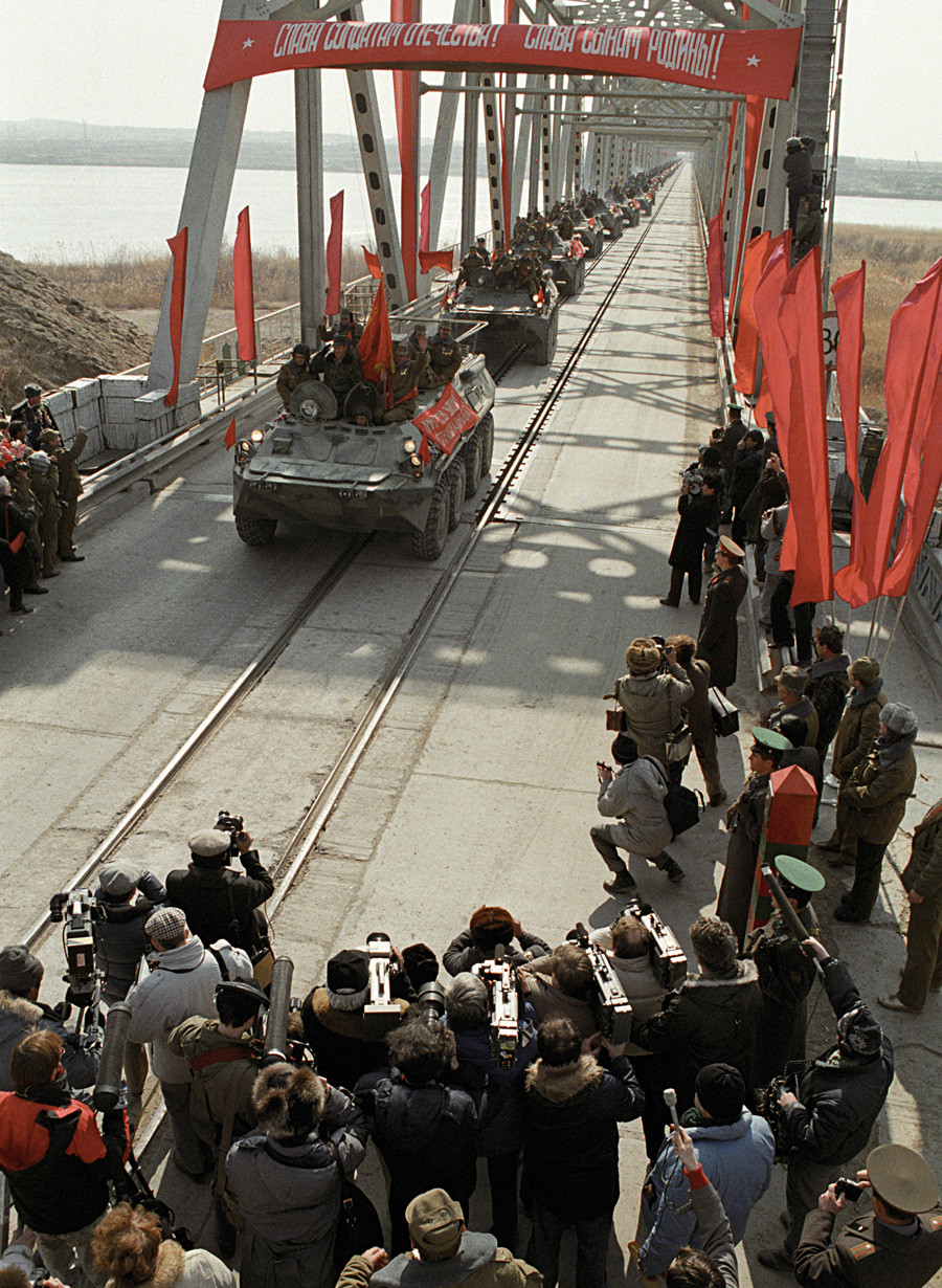 The last Soviet troop column crosses Soviet border after leaving Afghanistan.