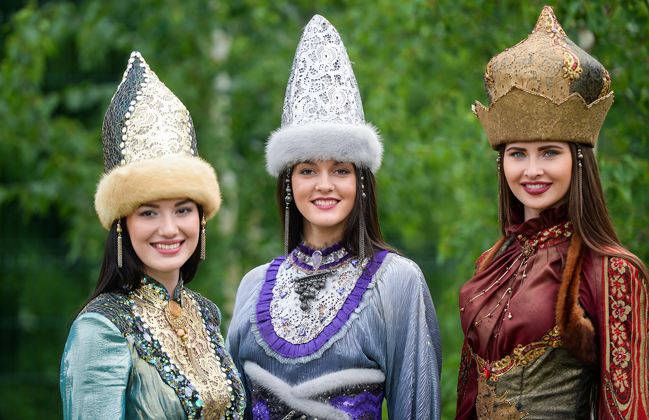 Tatar women in traditional outfits and hats during a celebration in Kazan, Tatarstan, Russia