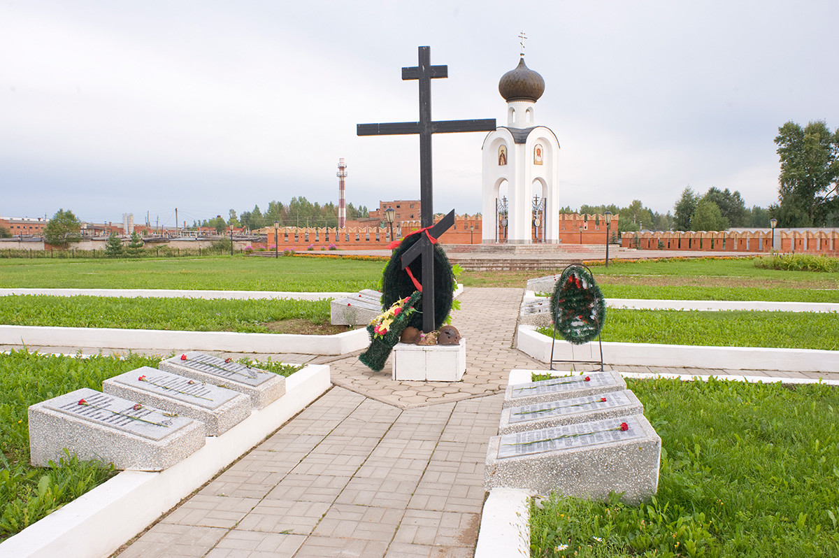 War Memorial Cemetery with common grave of thousands of Soviet soldiers. Background: Chapel of St. Alexander Nevsky & memorial wall to 100th & 101st Infantry Brigades (formed in Kazakhstan). August 14, 2016.