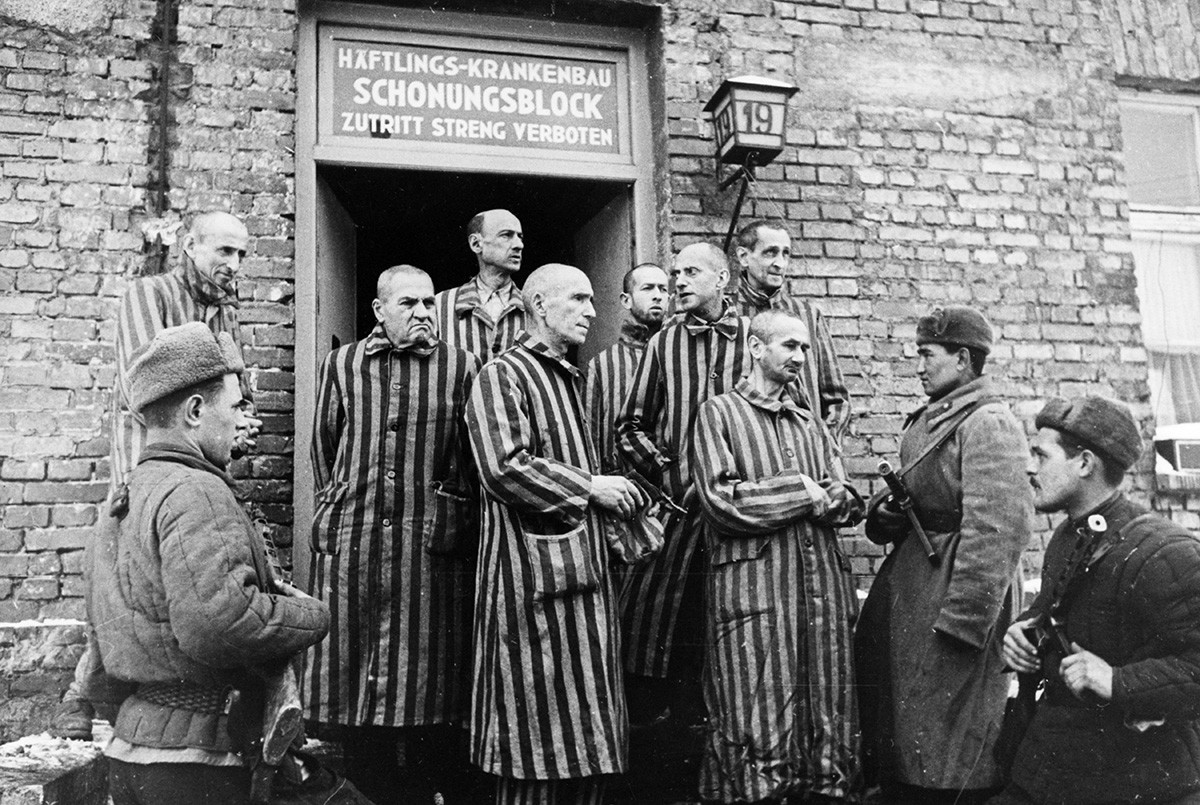 Soviet Red army soldiers with liberated prisoners of the Auschwitz concentration camp in Poland, 1945