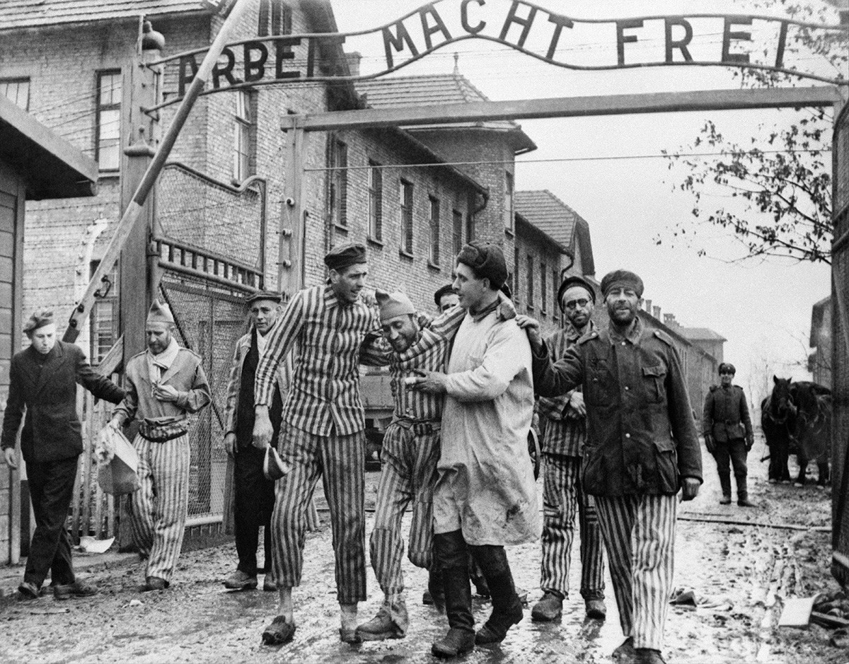 Liberated prisoners exit the labor camp Auschwitz-Birkenau, 1945