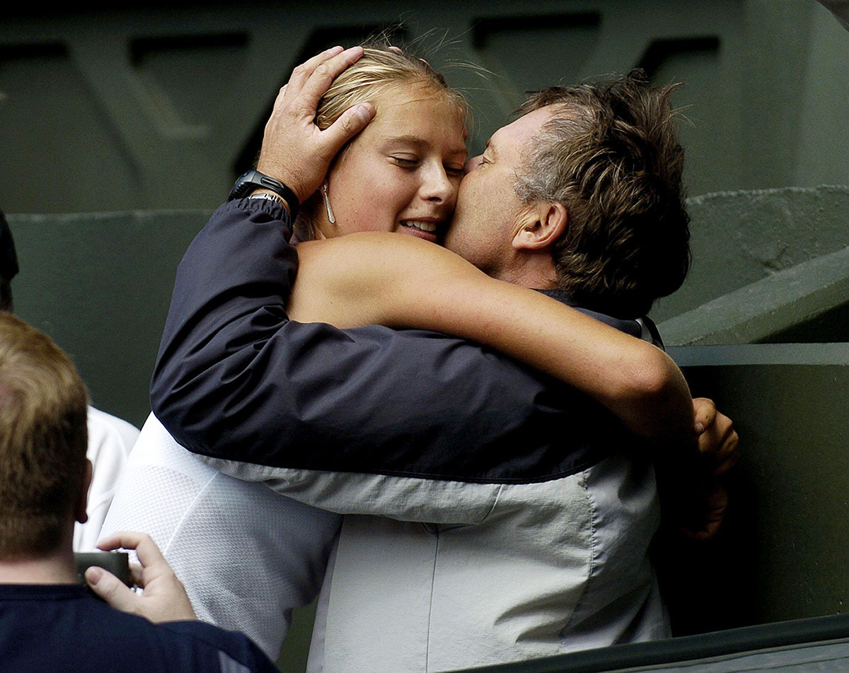 Sharapova with father Yuri after defeating Serena Williams in straight sets 6:1/6:4 in the final of the Ladies' Singles tournament at The Lawn Tennis Championships at Wimbledon