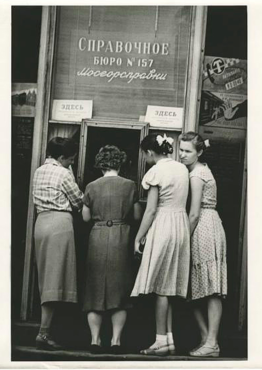 Women forming a line to an information desk