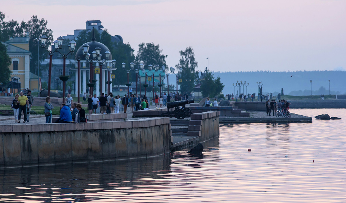 Locals walk durng the white nights season in Petrozavodsk.