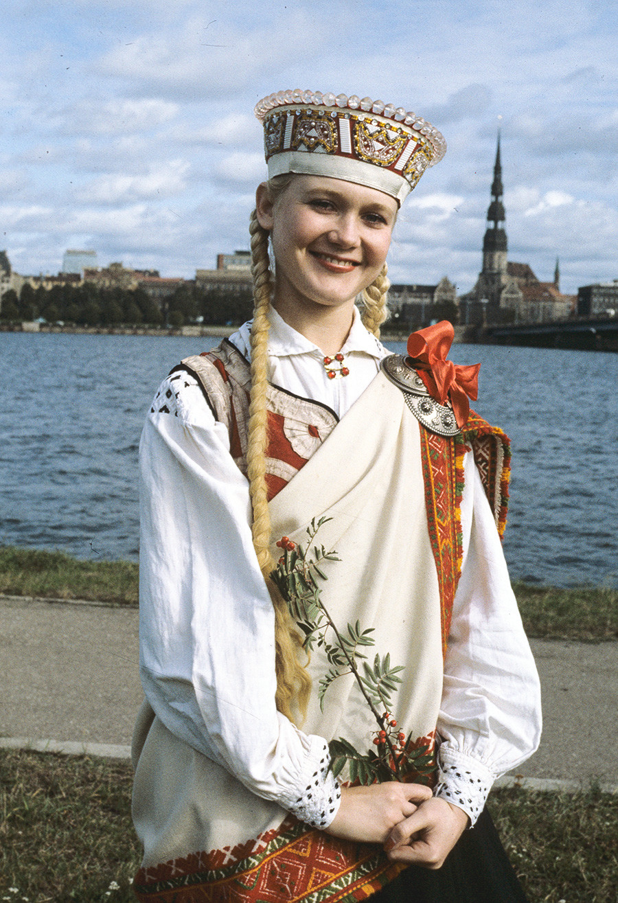 A girl in a Latvian national costume on the Riga waterfront, 1983.