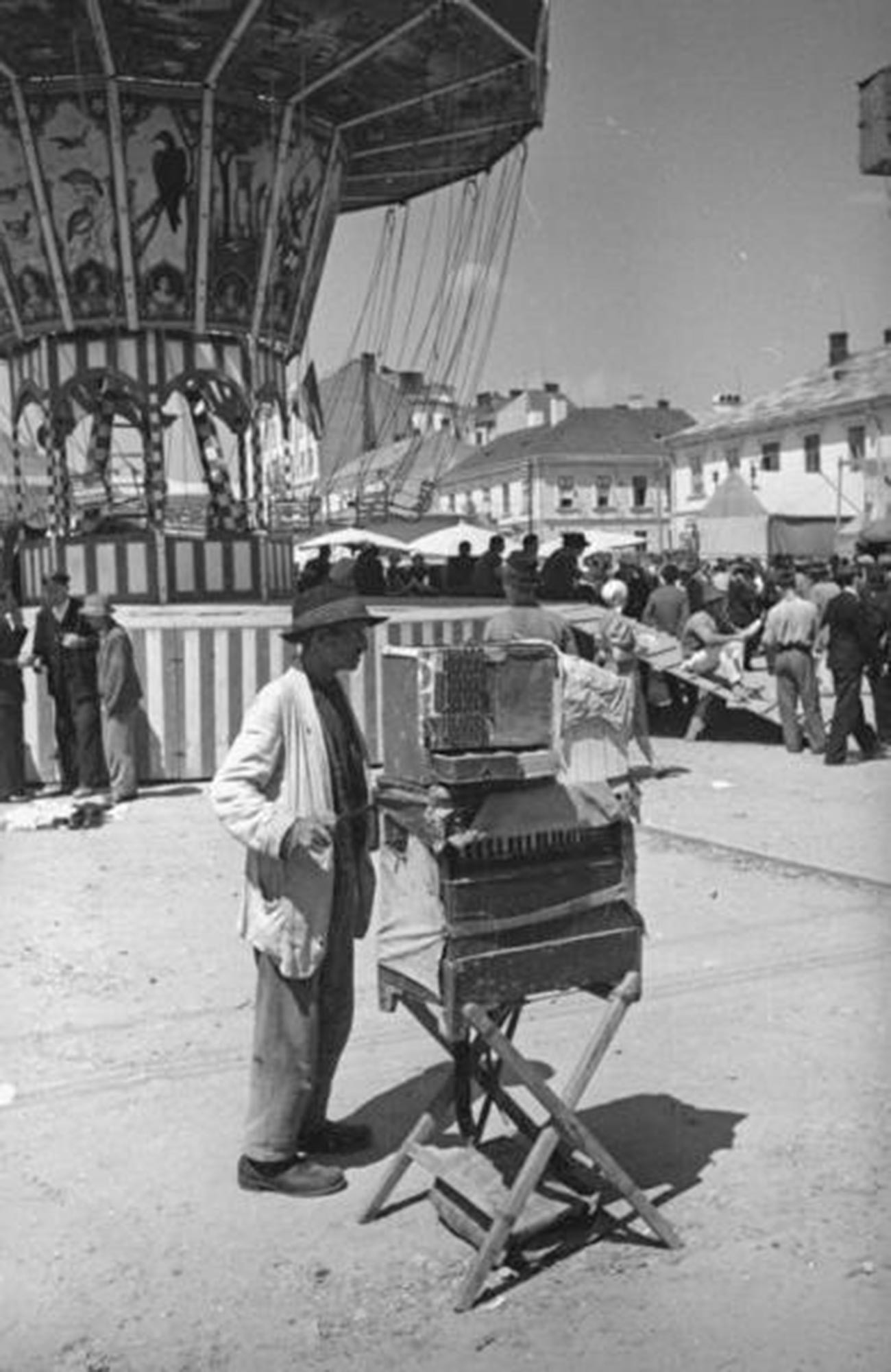 Organ grinder with parrot at a fair in the city of Chernivtsi, 1940  