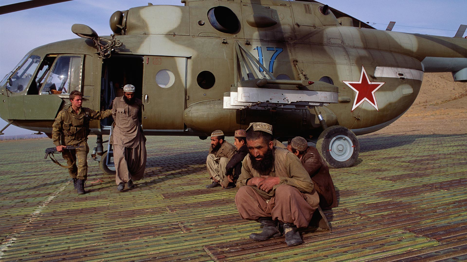 Soviet Guards Arrest Afghan Men.