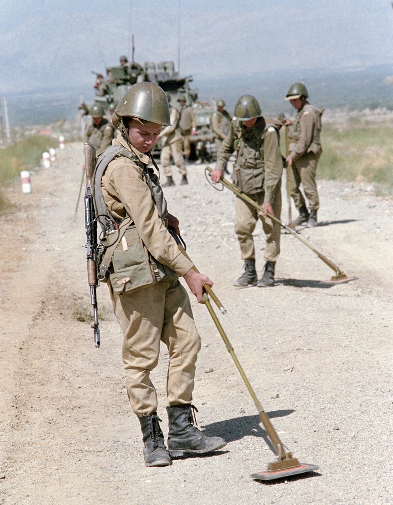 Soviet troops demine a road in Afghanistan.