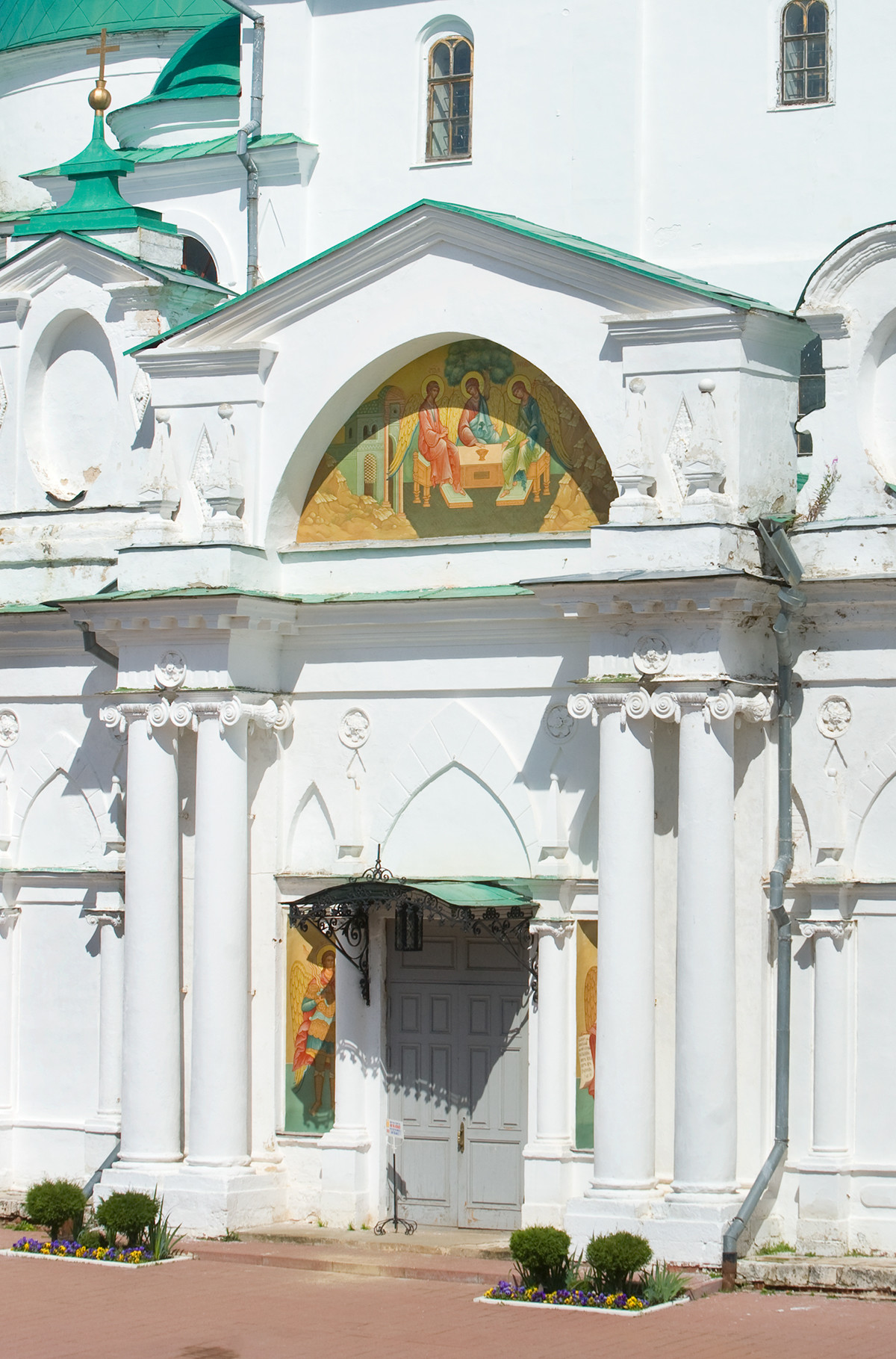 Cathedral of Conception of St. Anne. West view with main entrance. Painting of Old Testament Trinity on tympanum of narthex pediment. July 7, 2019 
