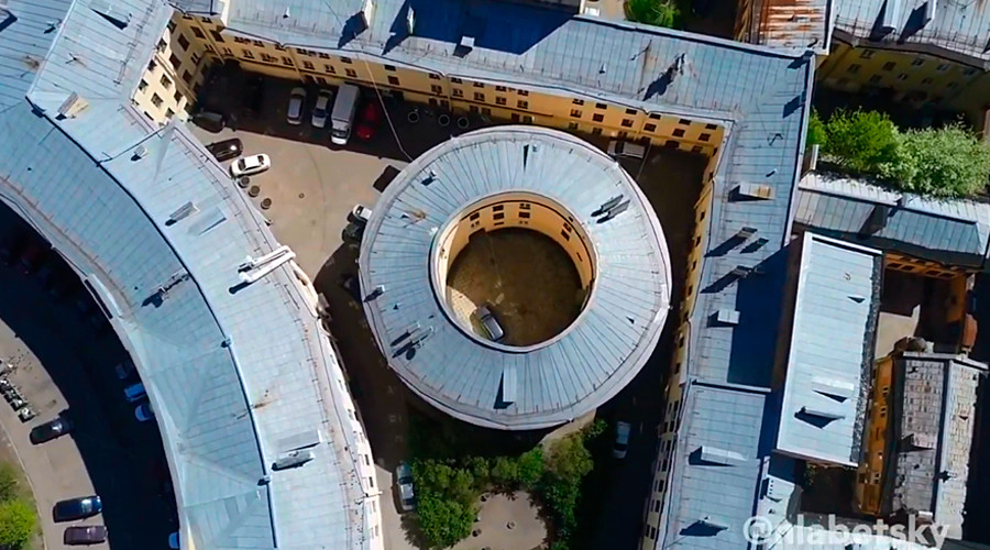 The round house in a big yard.