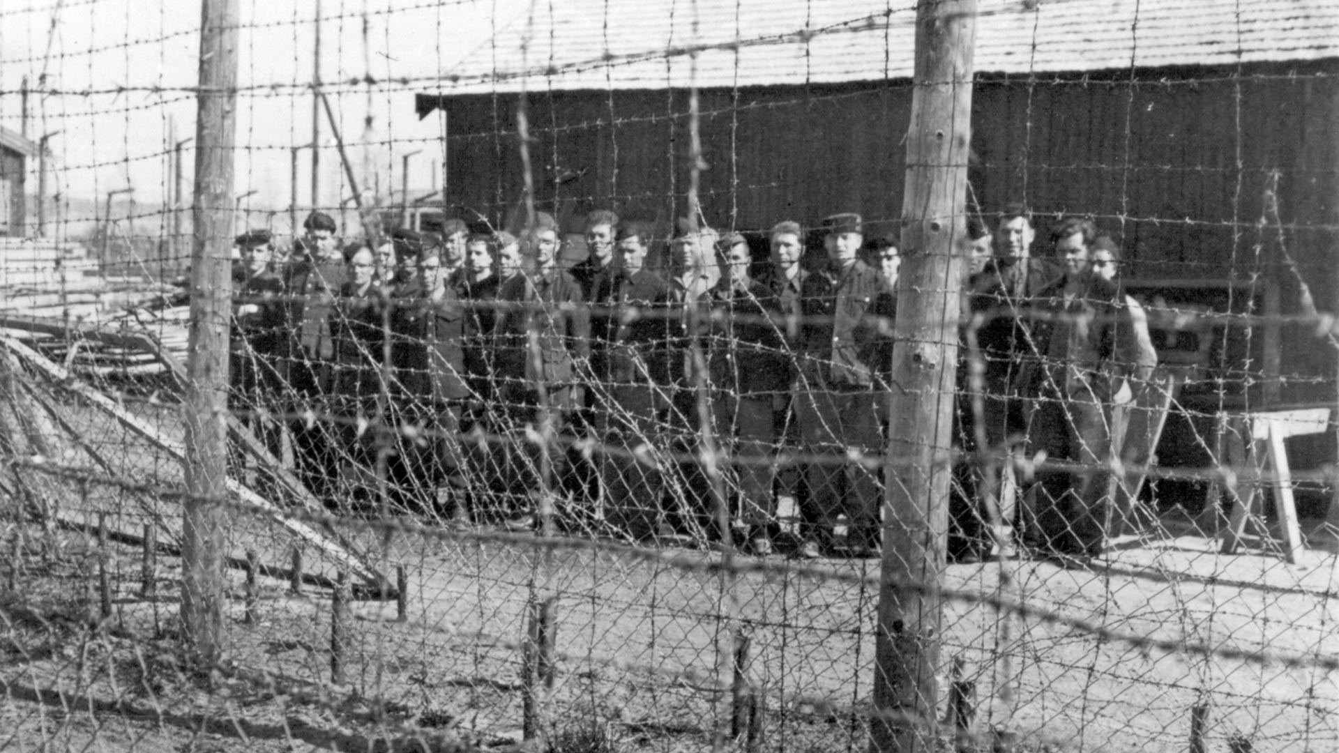 Soviet prisoners of war behind barbed wire at Falstad camp.