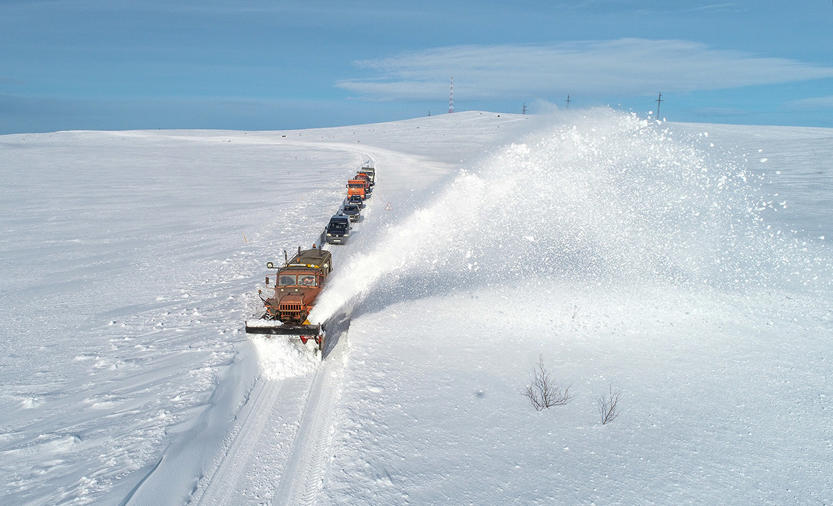 Snowplow based on the Ural car on the section of the Kola - Serebryanskiye HPP highway towards the village of Teriberka in the Murmansk region