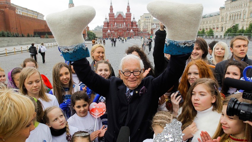 Famous French fashion designer Pierre Cardin walking on Moscow's Red Square with pupils of the Ekol children's art center, 2010